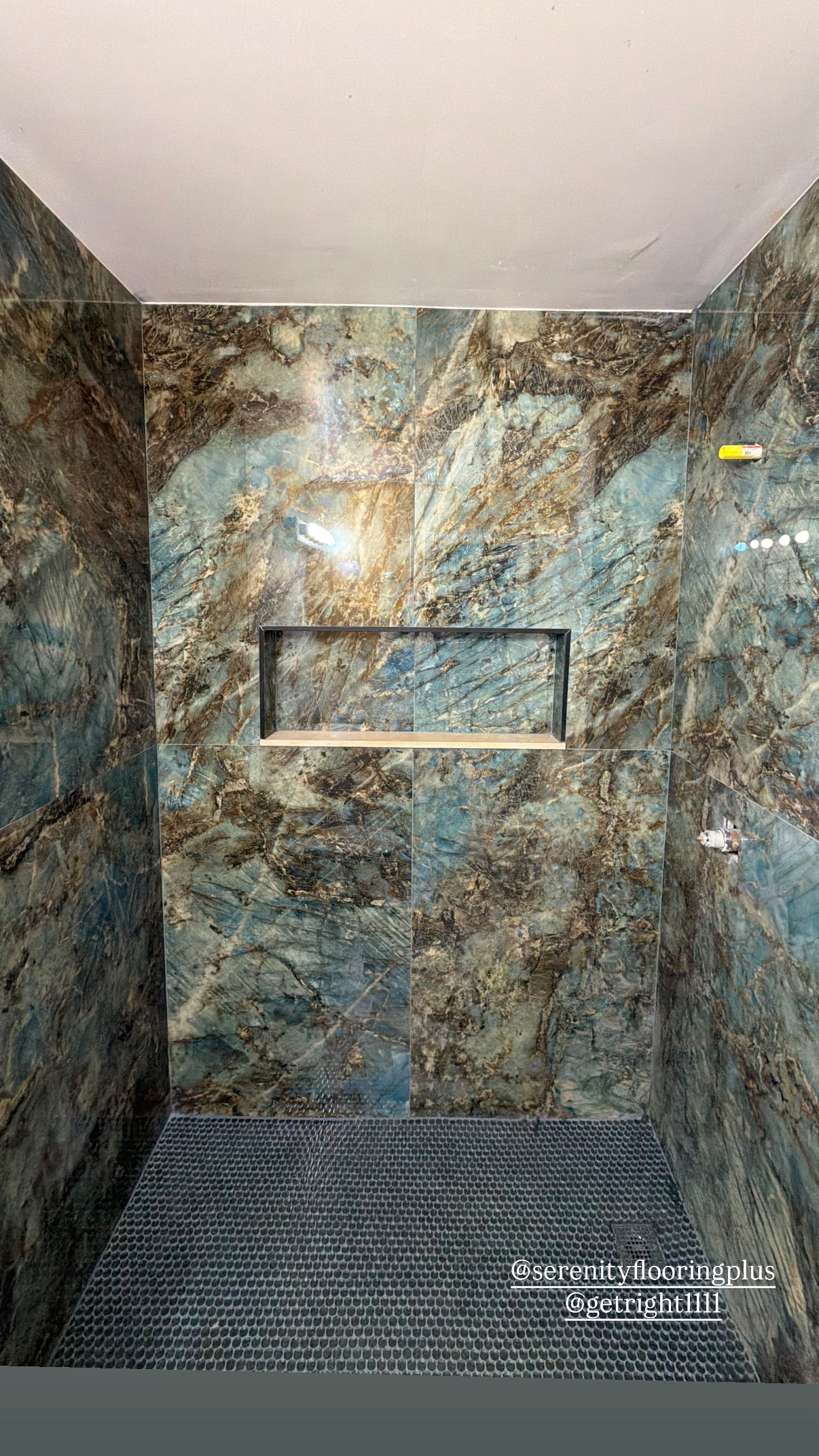 Modern shower with marble tile walls and glass enclosure — Highlands County
