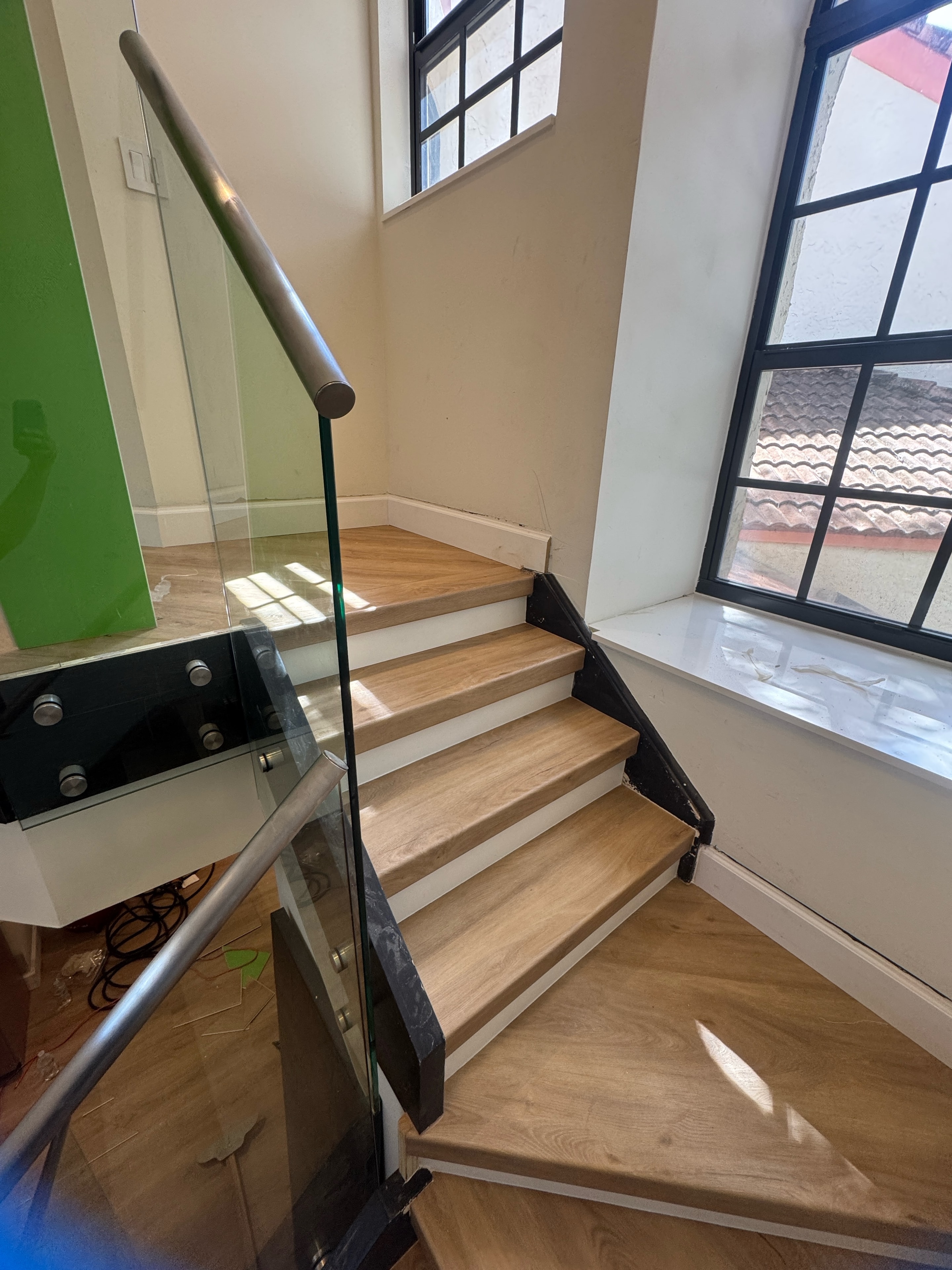 Wooden staircase with metal handrail — interior remodel Sebring FL