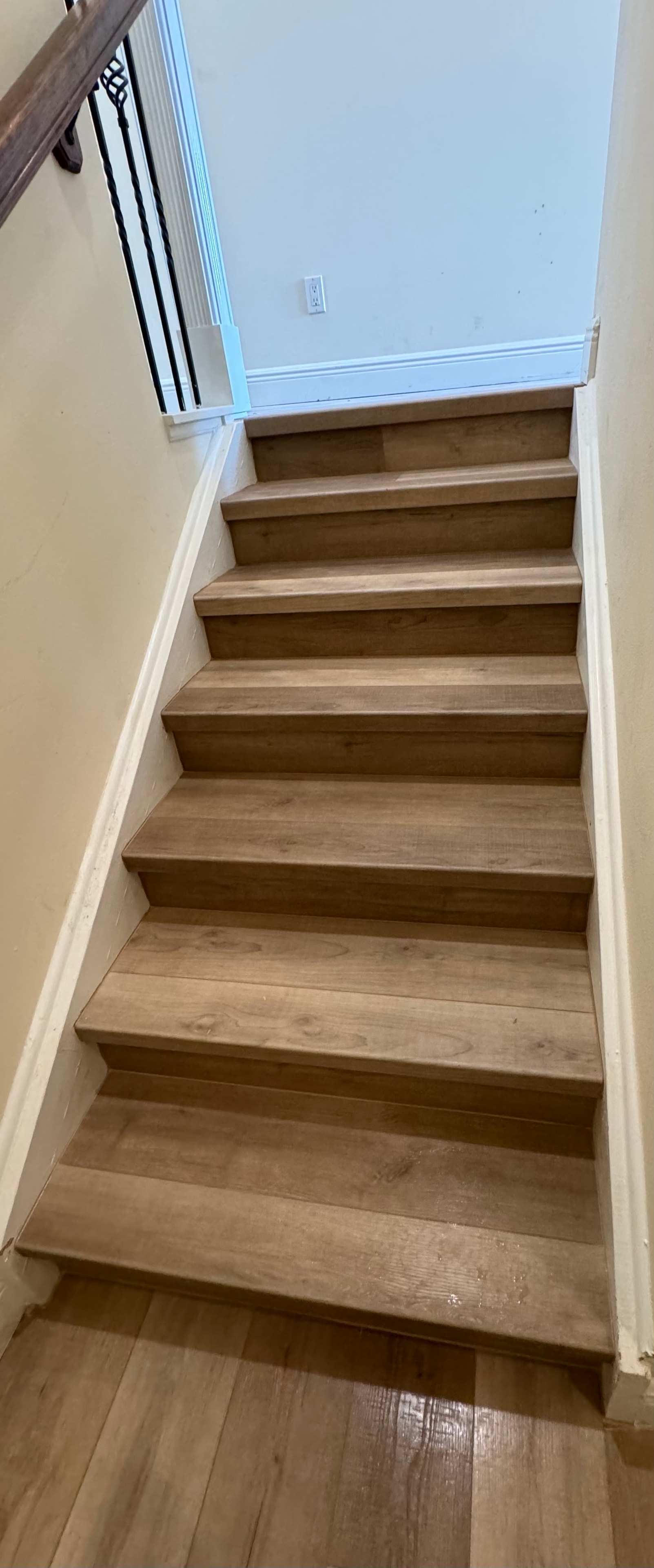 Wooden staircase leading to bright room — Highlands County remodel